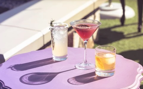 a group of glasses with liquid in them on a table