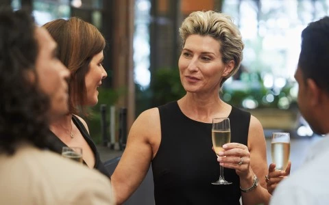 a woman holding a glass of wine