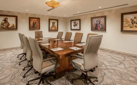 a conference room with a table and chairs