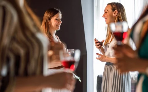 a person holding a glass of wine