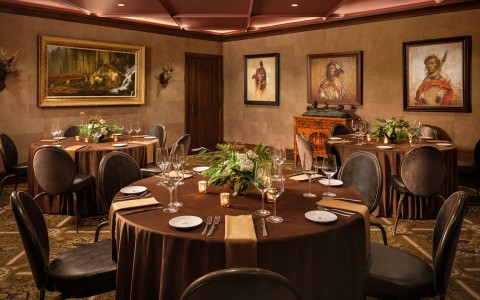 a room with round tables and chairs