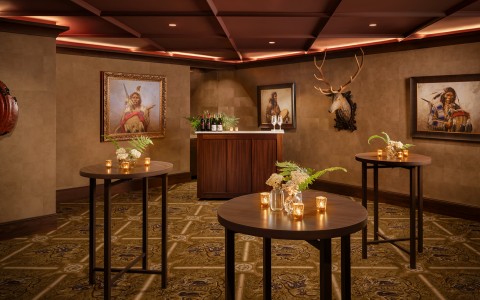 a room with tables and a bar