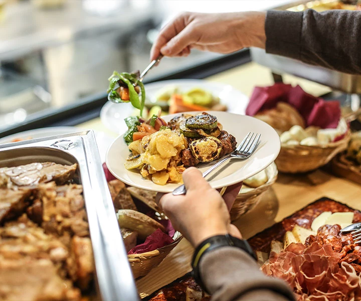 a person holding a fork and knife