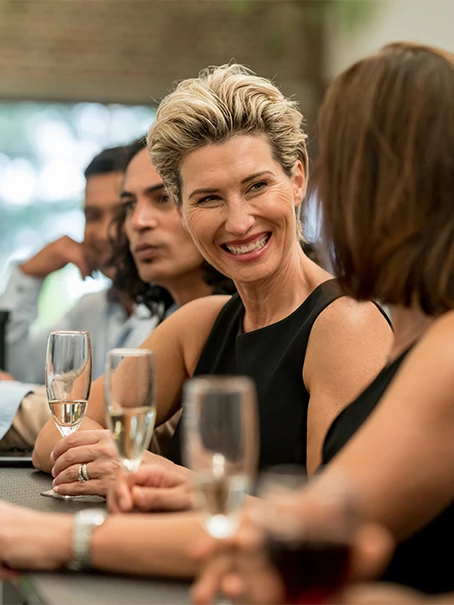 a woman holding a glass of wine