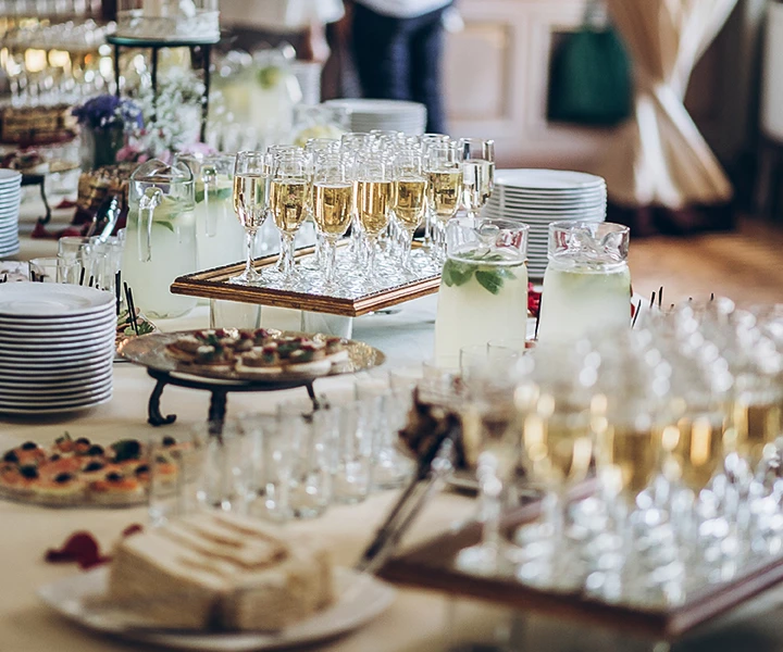 a table full of glasses and plates
