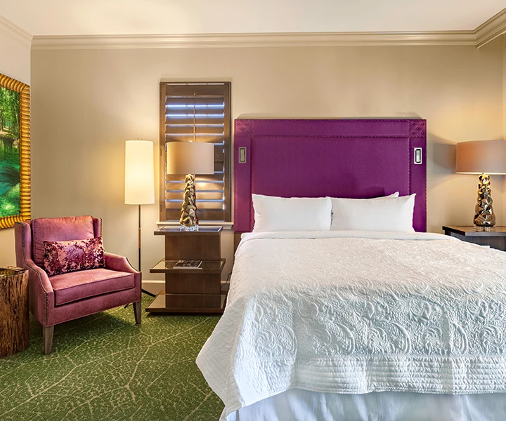 a bedroom with a bed and a chair