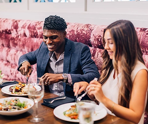 a man and a woman eating at a table