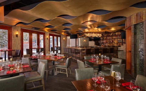 a restaurant with tables and chairs