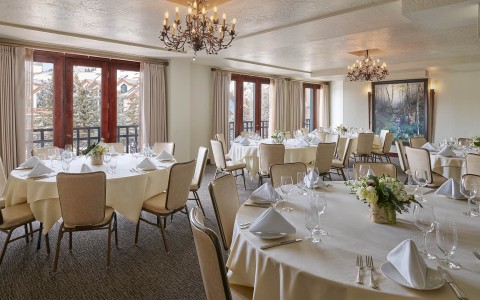 a room with tables and chairs