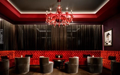 Red velvet booths, dark gray velvet chairs 