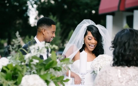 Bride and groom laughing 