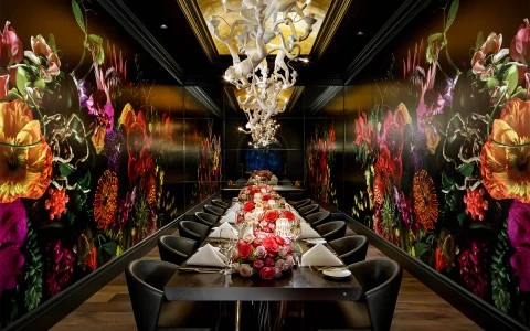 Dark, floral themed dining room set up 