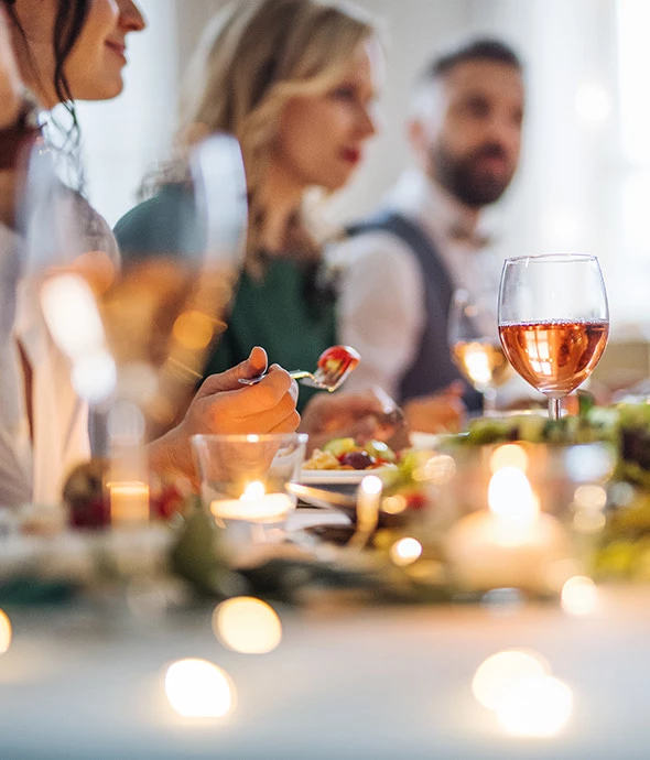 Close up of table set up and someone eating their food 