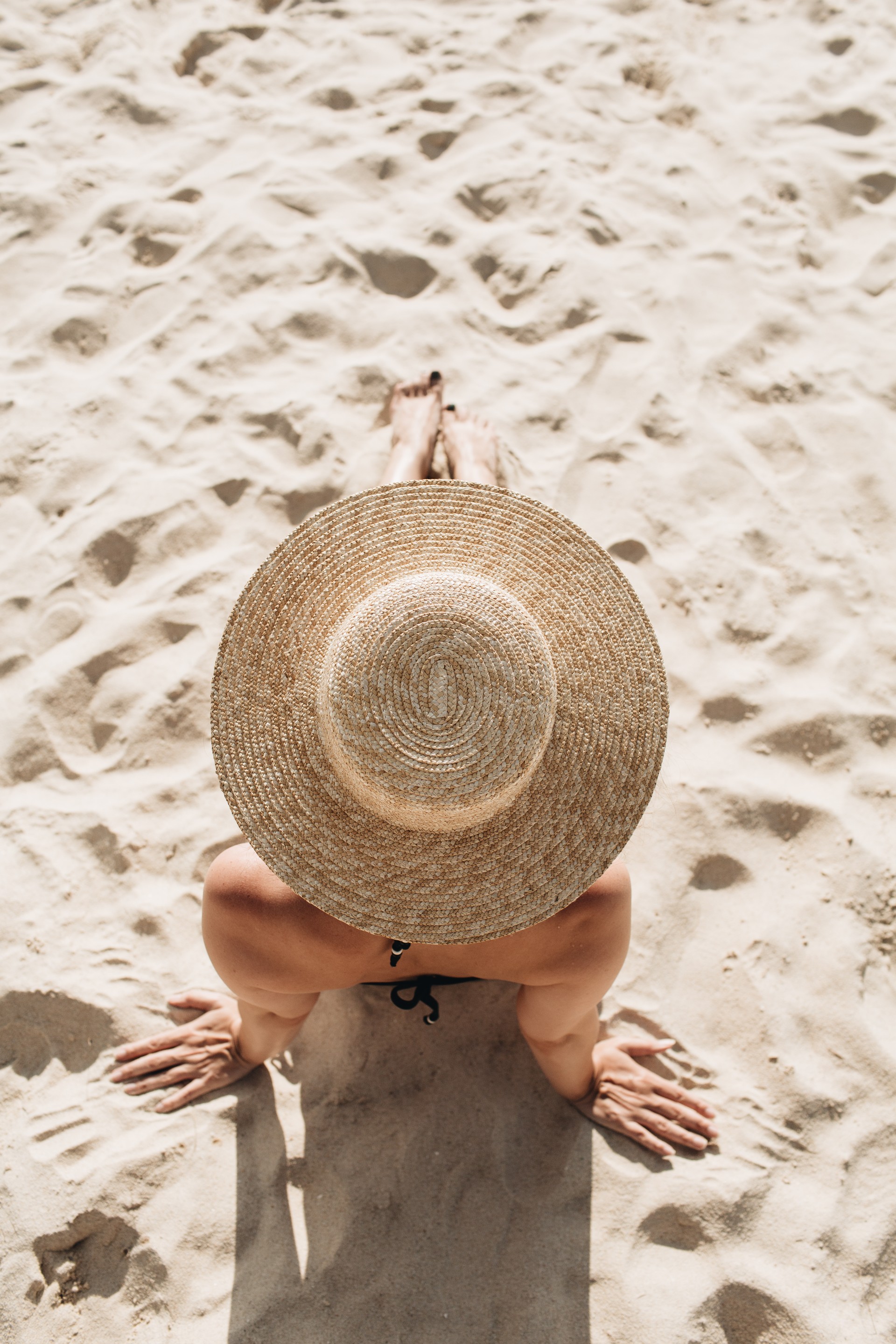 a person sitting on the sand