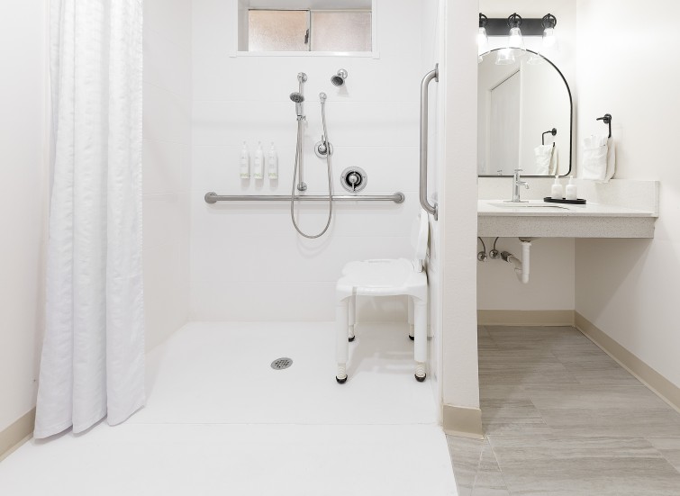 a bathroom with a shower and sink