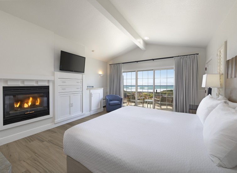 a room with a fireplace and a bed