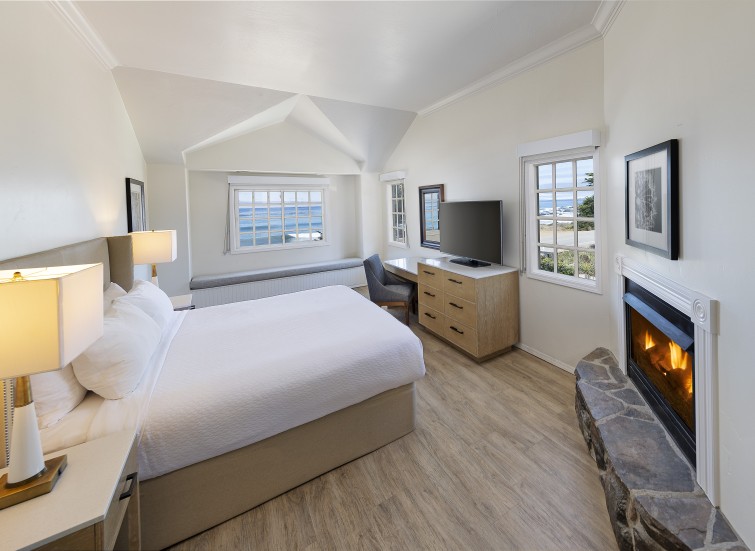 a room with a fireplace and a bed