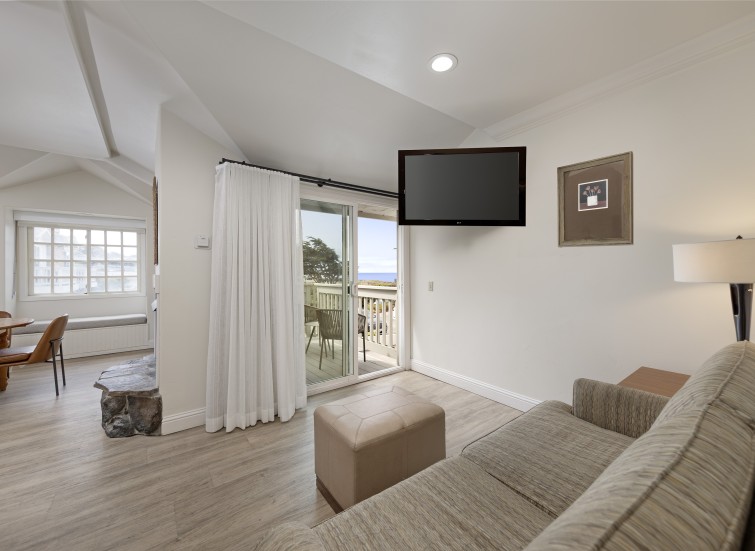 a living room with a television on the wall