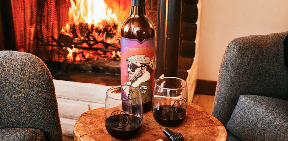 a bottle of alcohol and glasses on a table