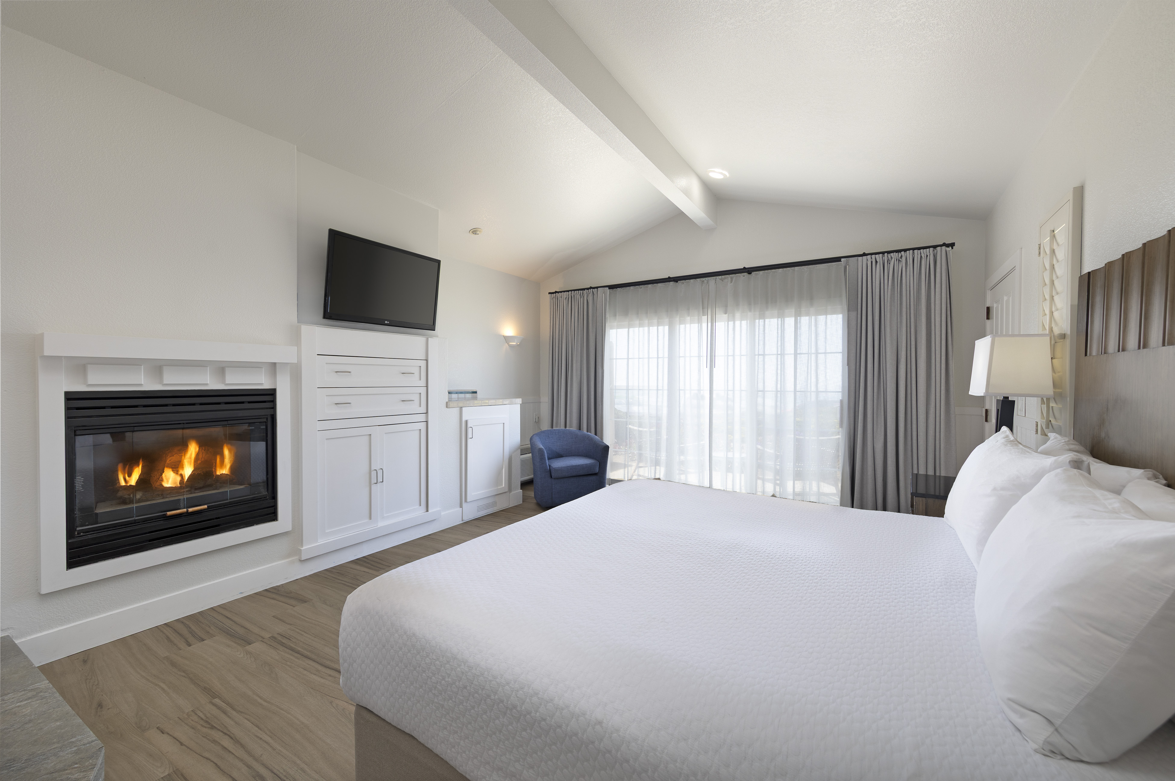 a room with a fireplace and a bed