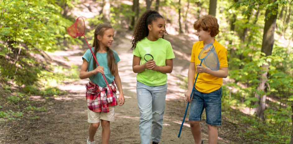 a group of kids holding fishing nets