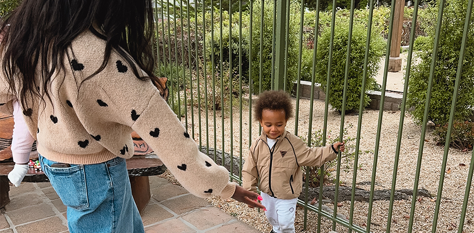 a woman reaching for a child