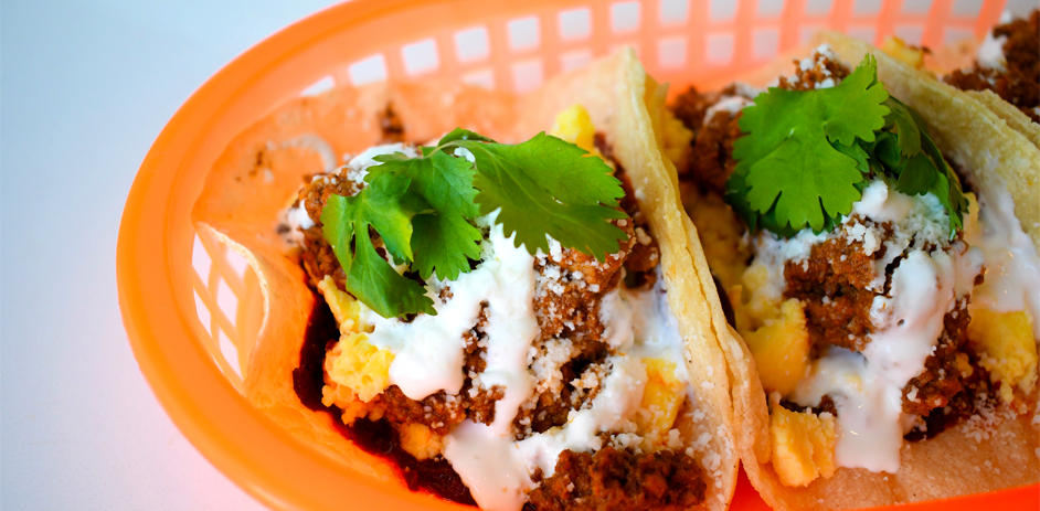 Close up of tacos in a plastic basket