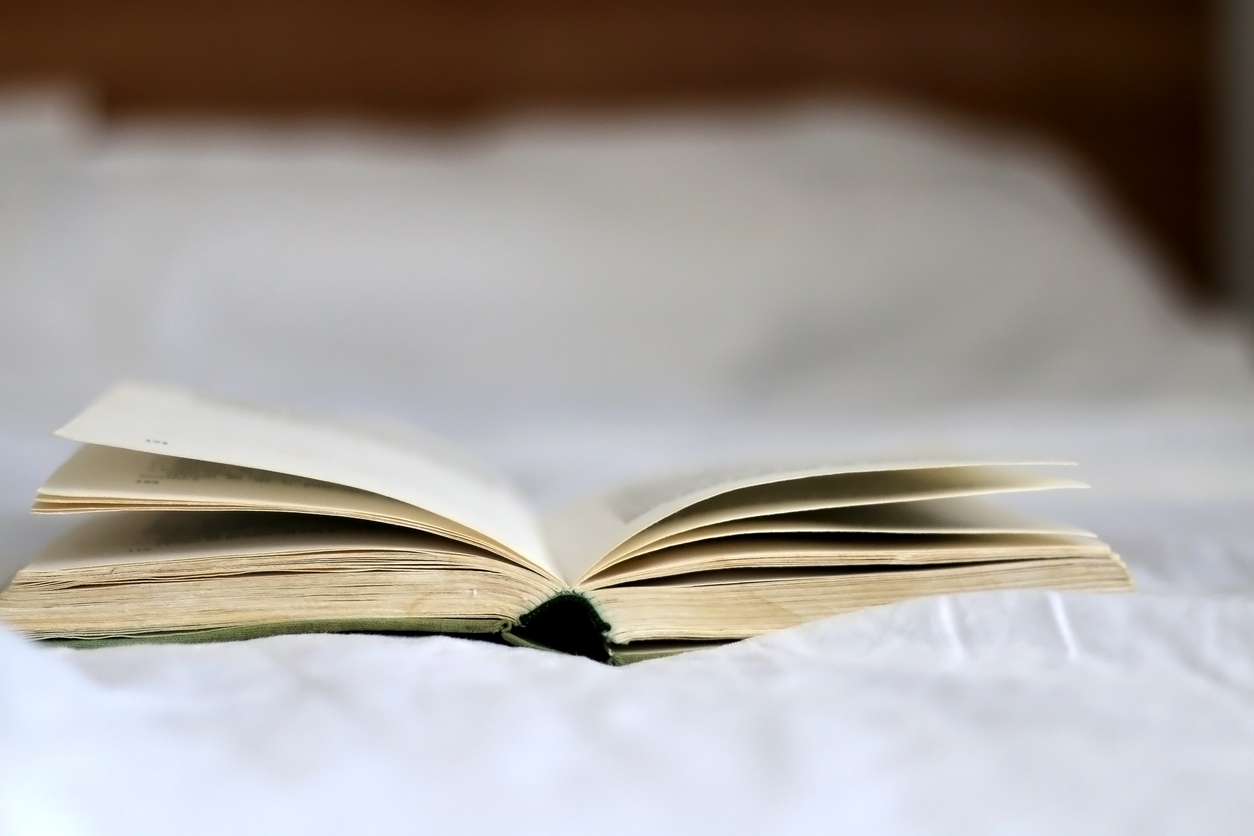 an open book on a white surface