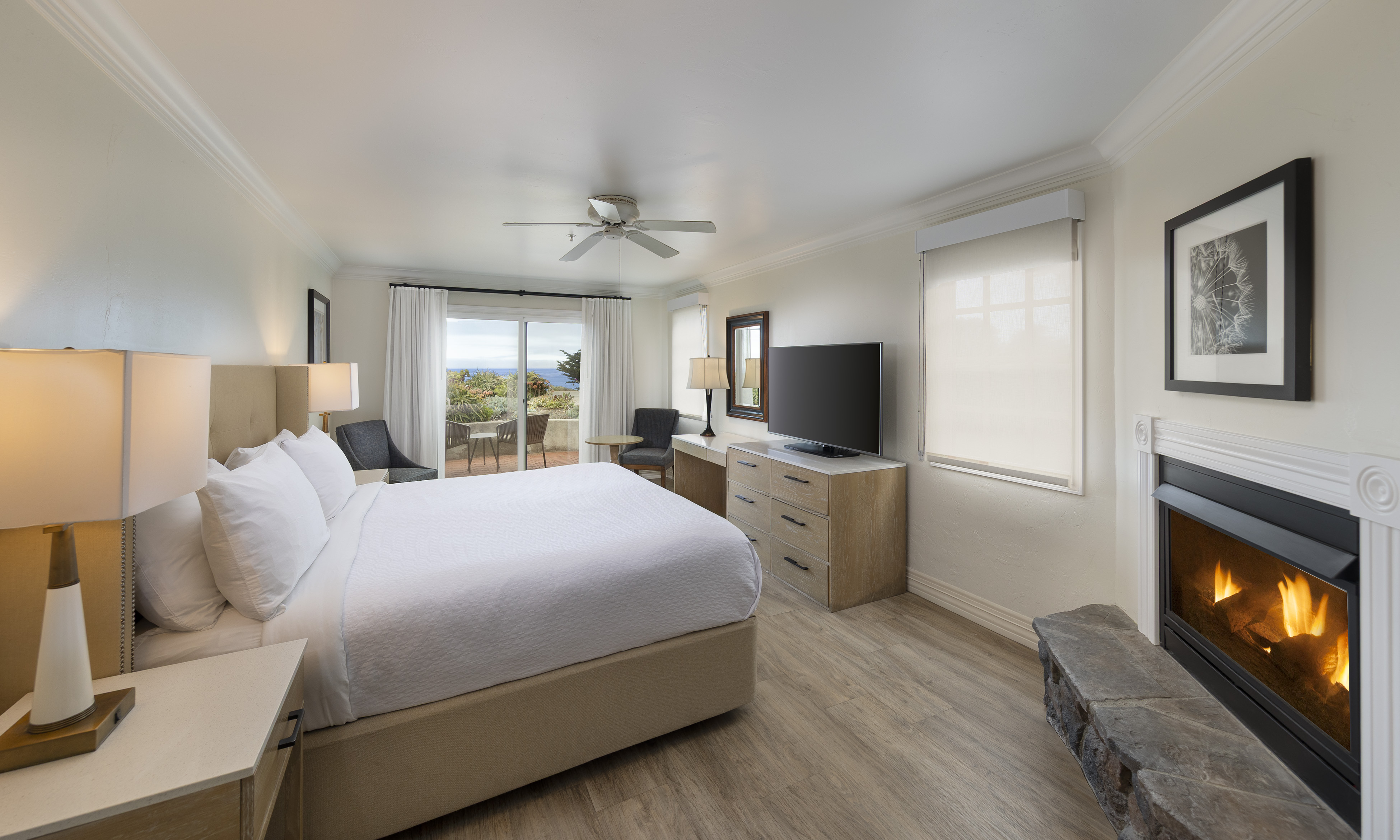 a bedroom with a large bed and a television