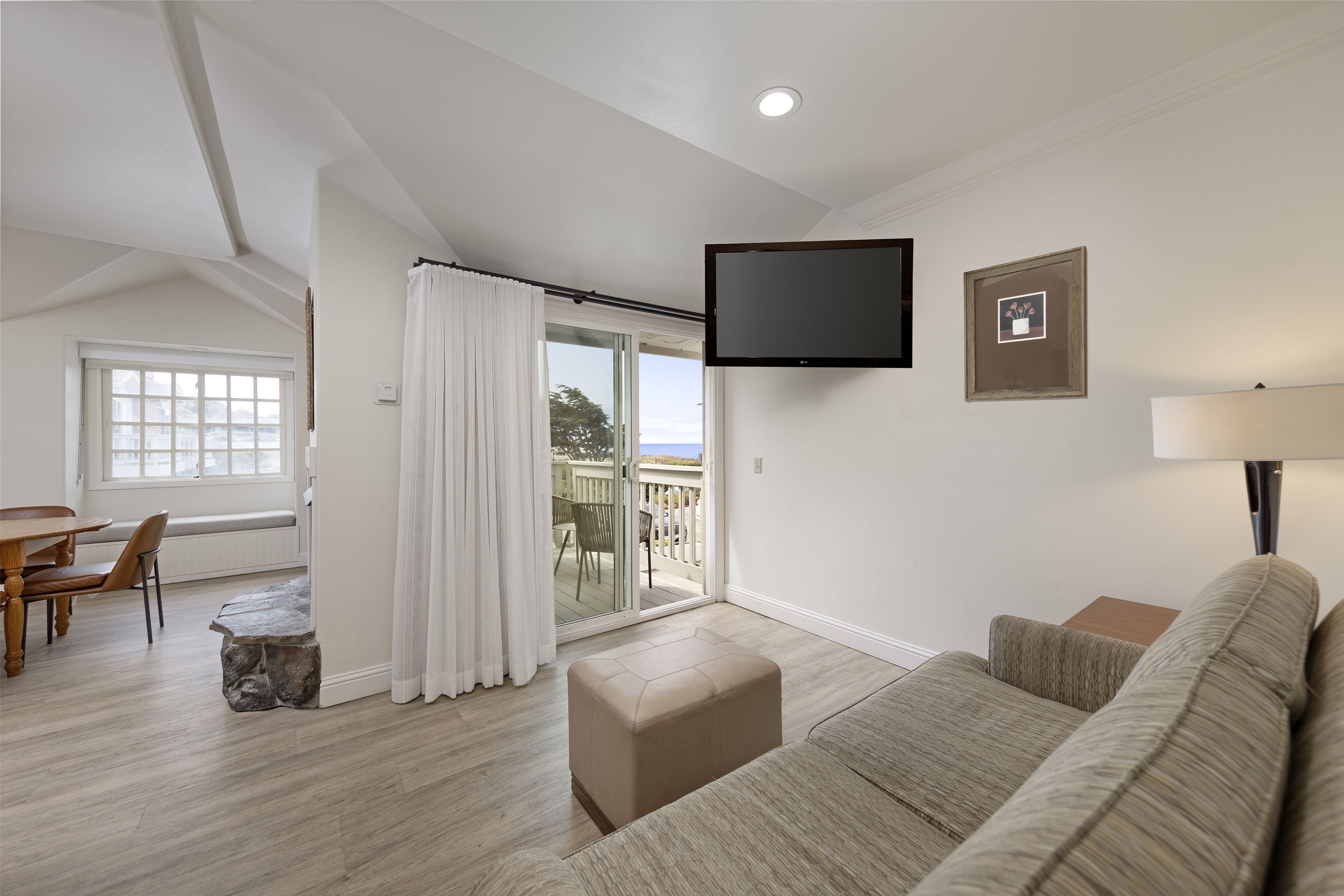 a living room with a television on the wall