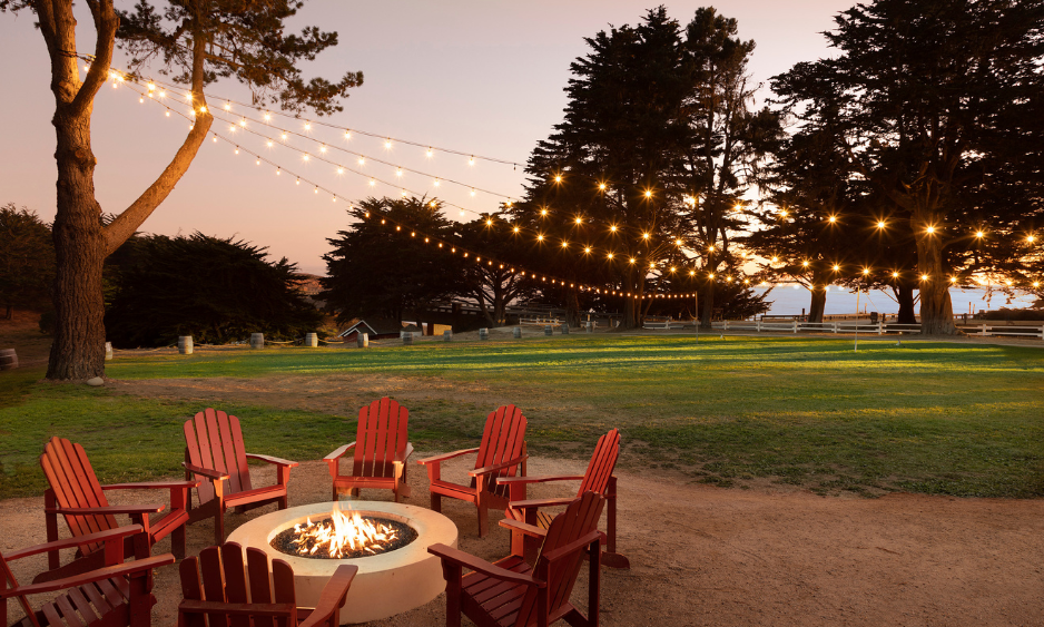 a fire pit with chairs around it