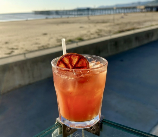 a drink on a railing