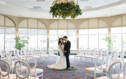 image of the newly wed couple in their venue while its empty