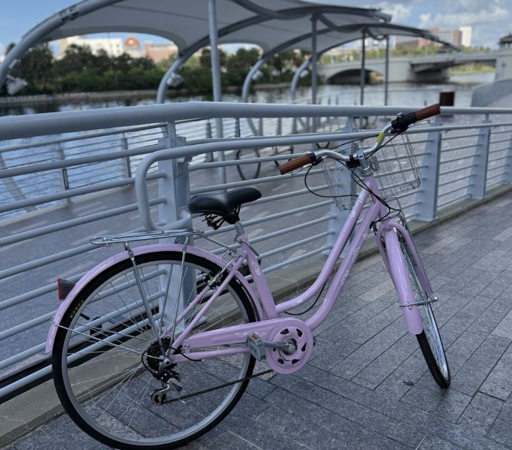 a bicycle parked on a sidewalk