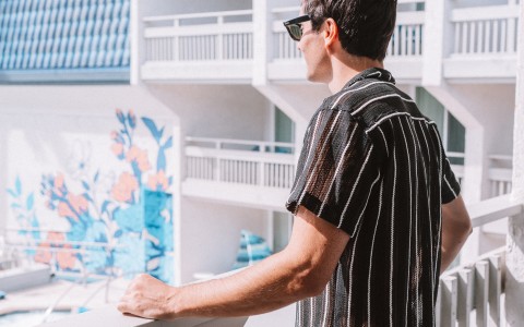 a man standing on a balcony