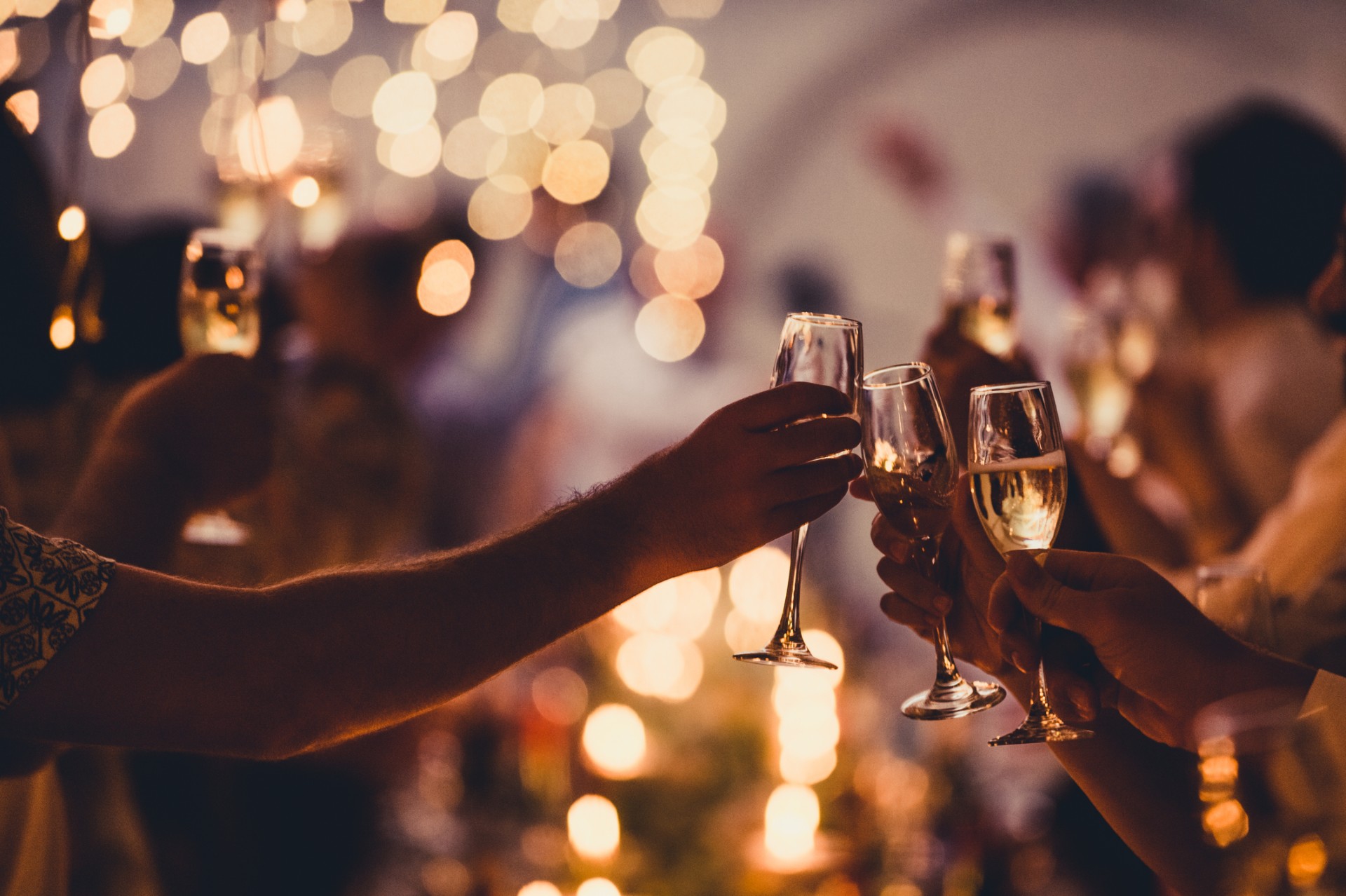 a group of people holding wine glasses