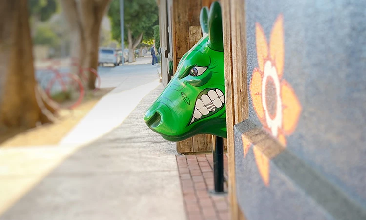 green dog head on a wall