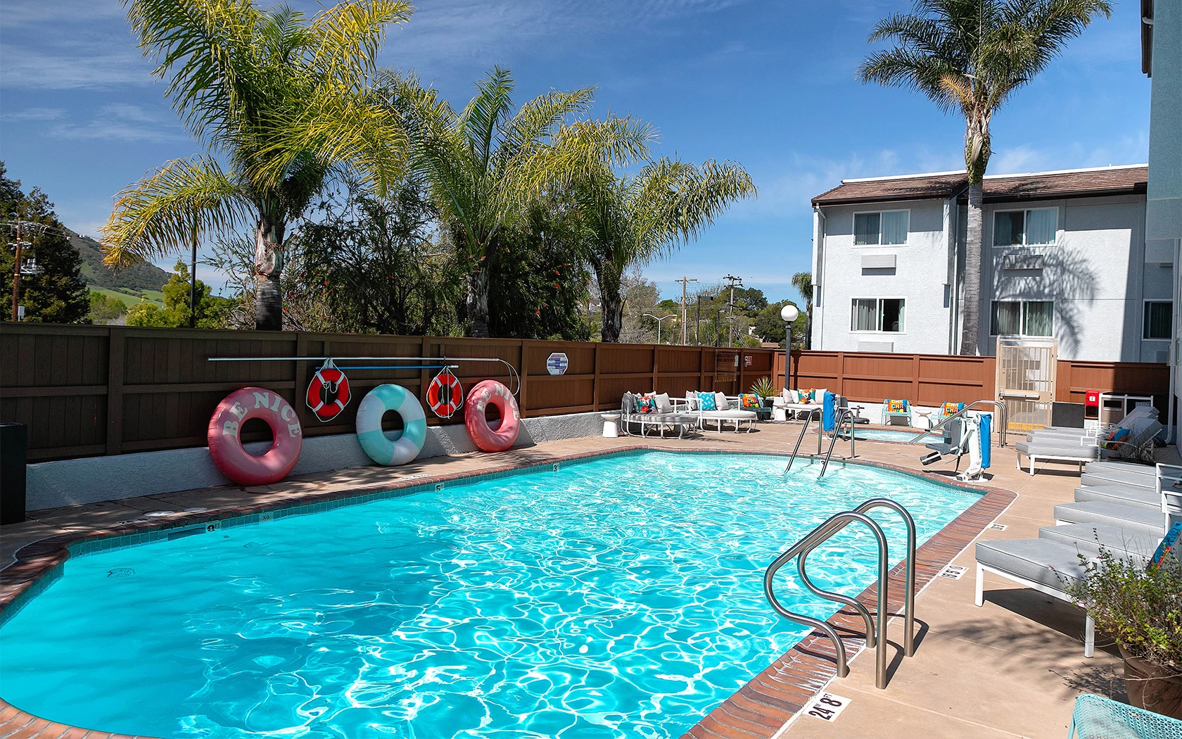 pool with tubes to float and seating area to the side