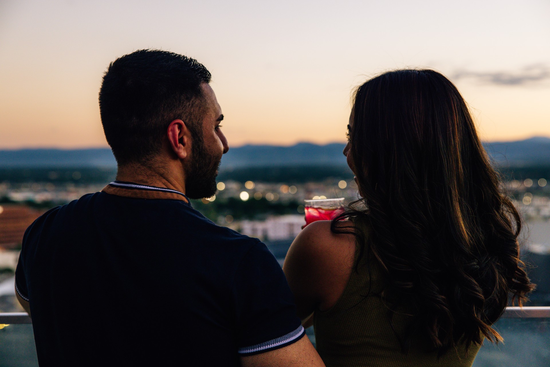 a man and woman looking at each other