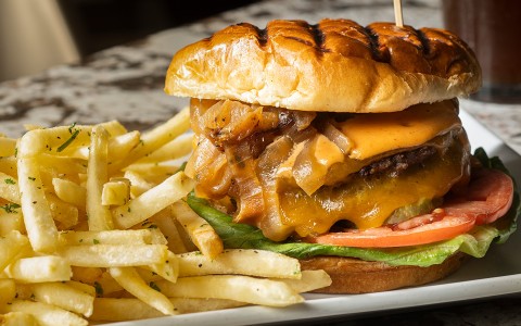 a burger and fries on a plate