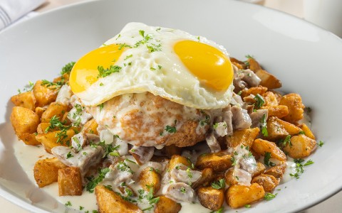 a plate of food with a fried egg on top