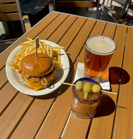 a burger and fries on a table
