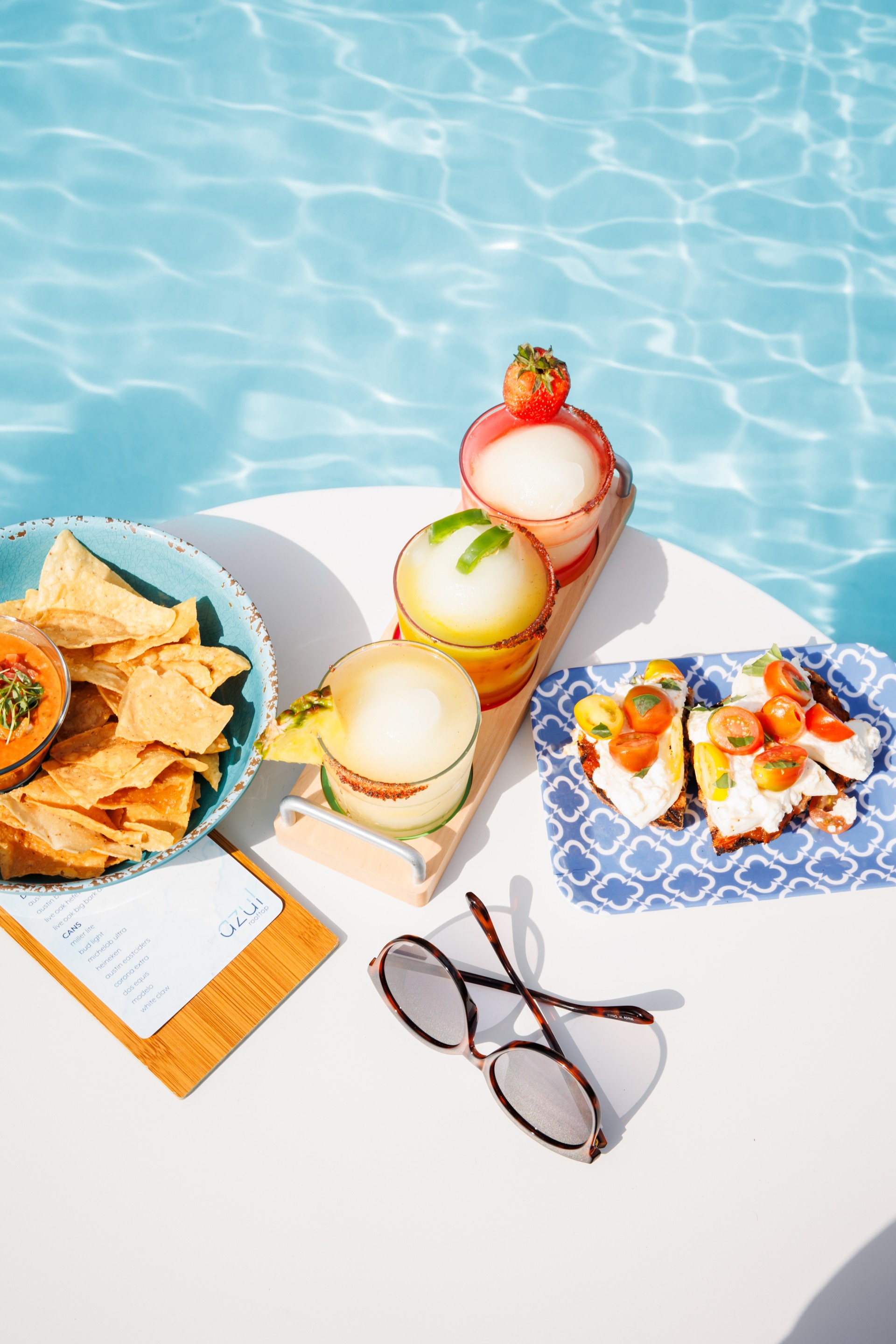 a pool with drinks and snacks