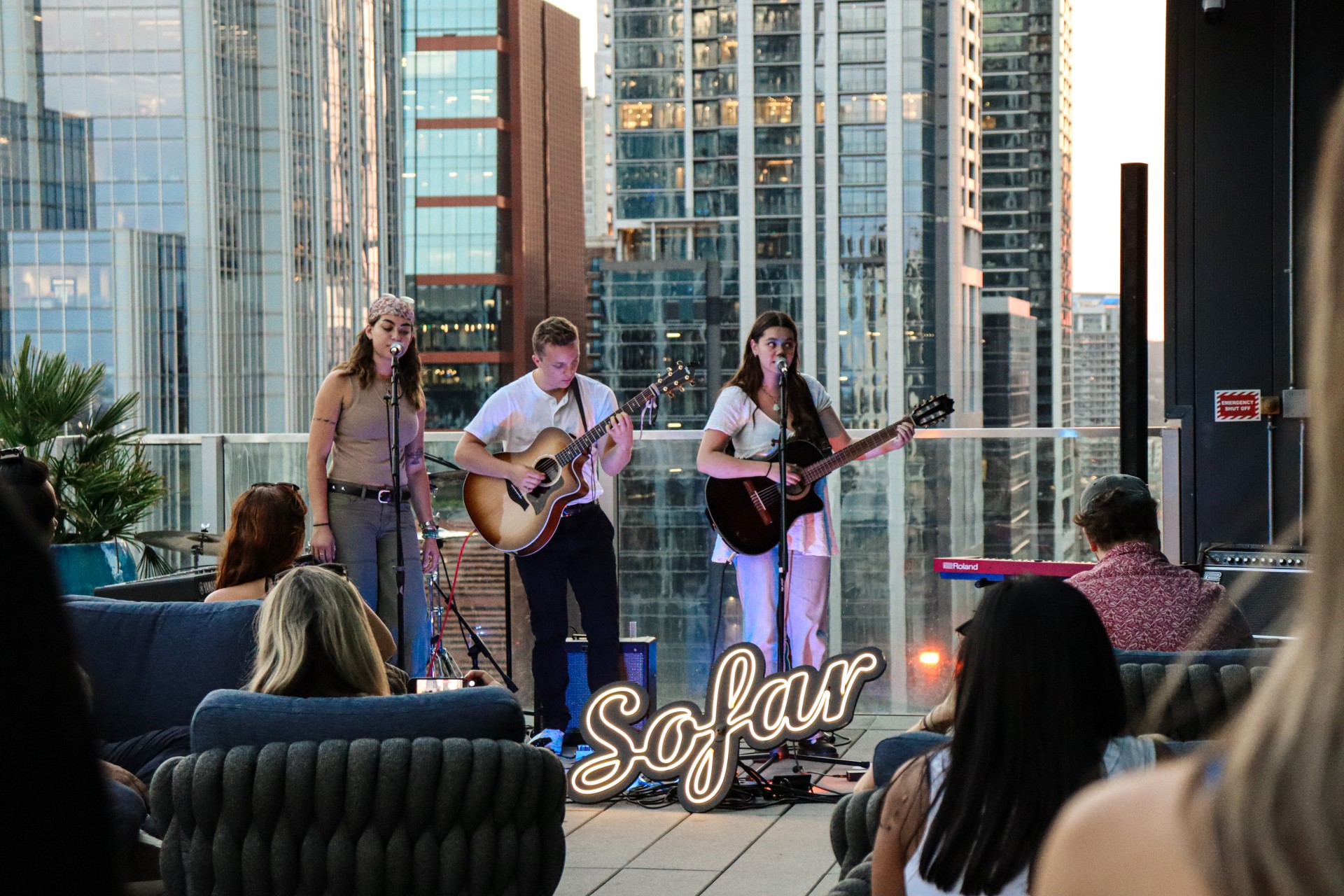 a group of people playing instruments on a rooftop