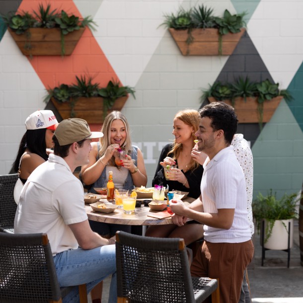 a group of people sitting around a table