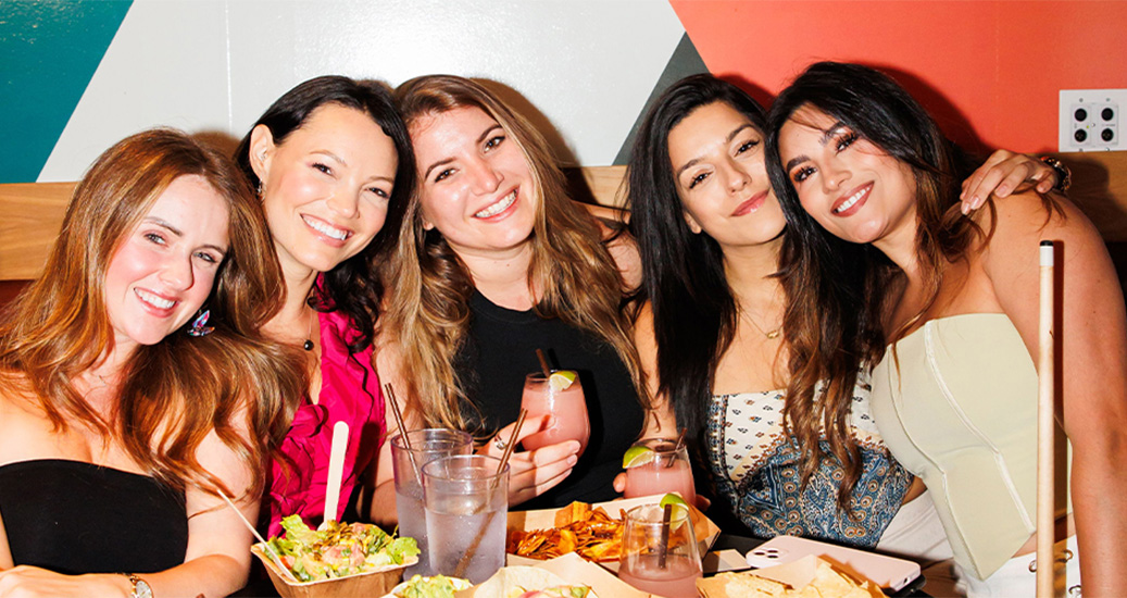 a group of women smiling
