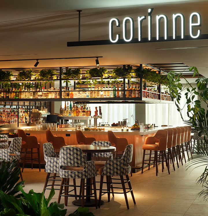 a bar with chairs and tables in a restaurant