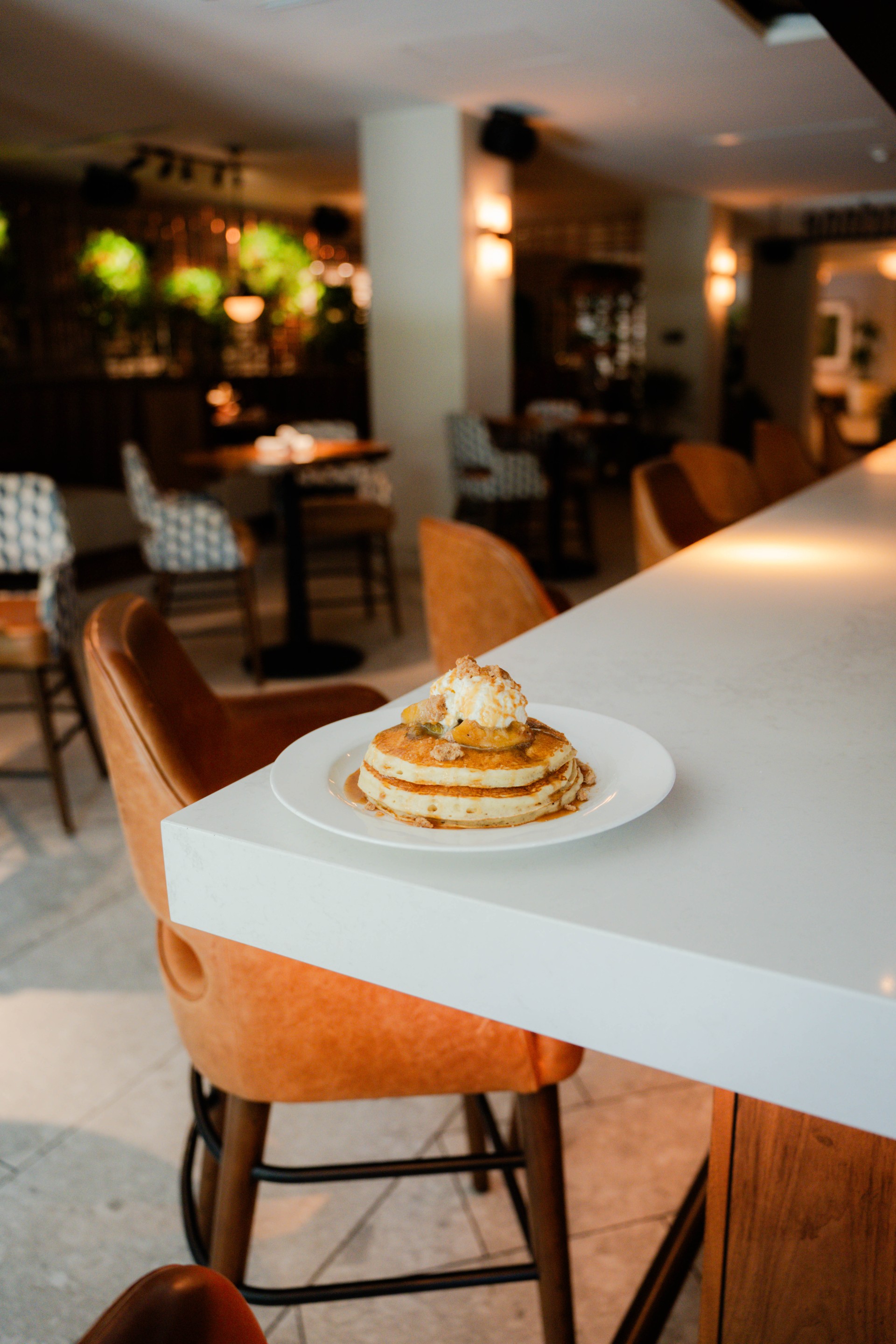 a plate of pancakes with ice cream on it