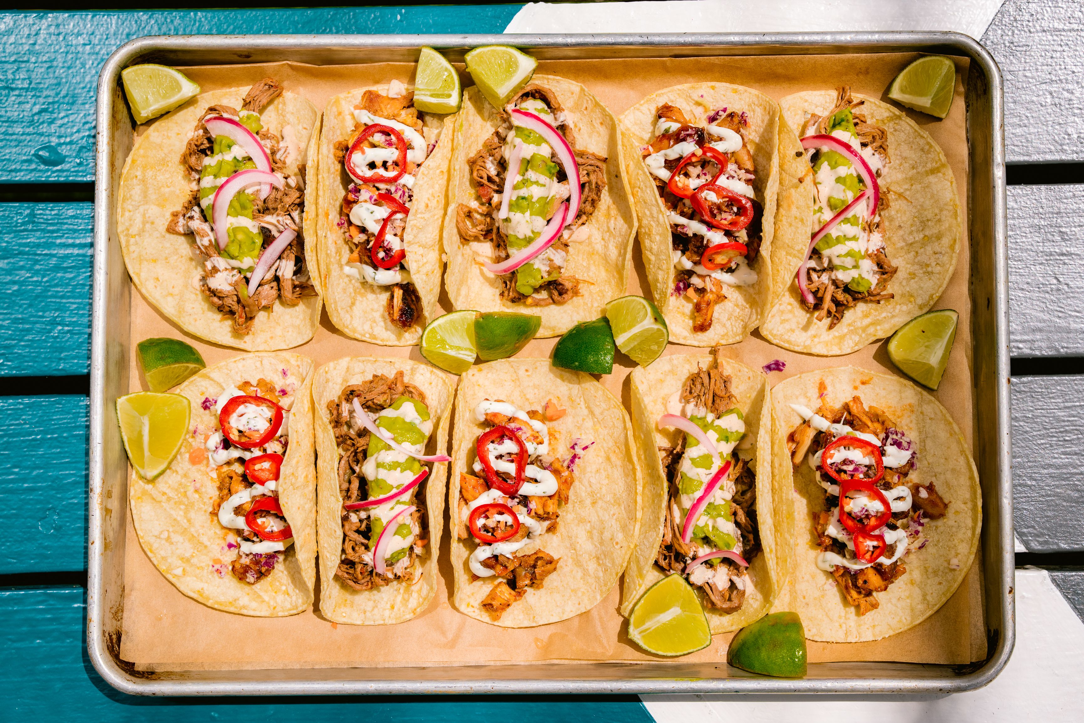 above photo of different type of tacos served in the tray