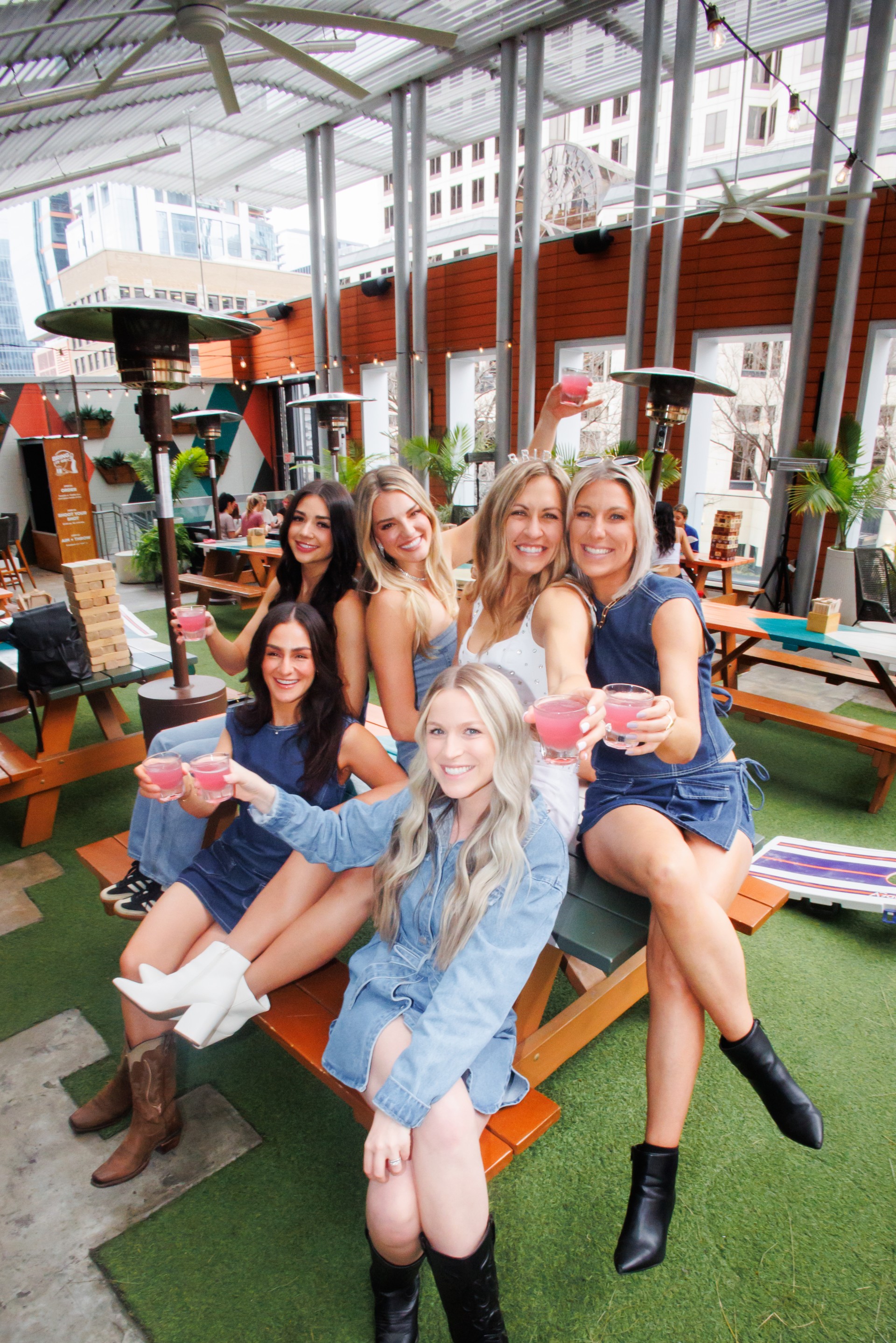a group of women sitting on a bench